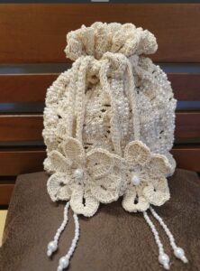 pearl embellished crochet pouch